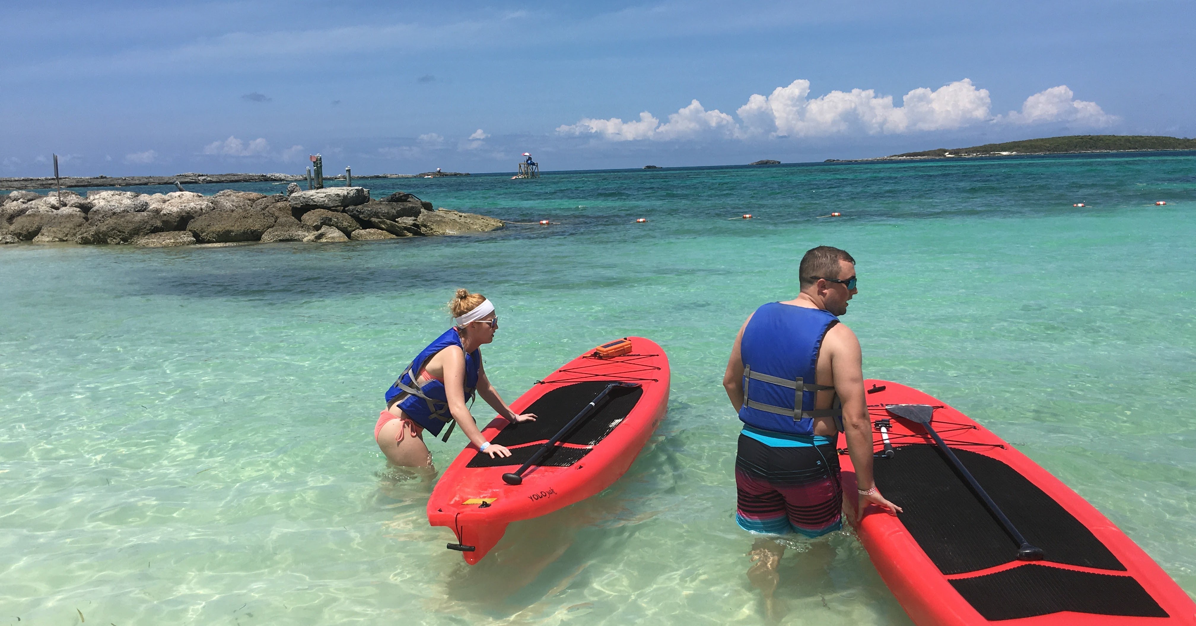 Paddle boarders using RokPak Pioneer Series in the Bahamas